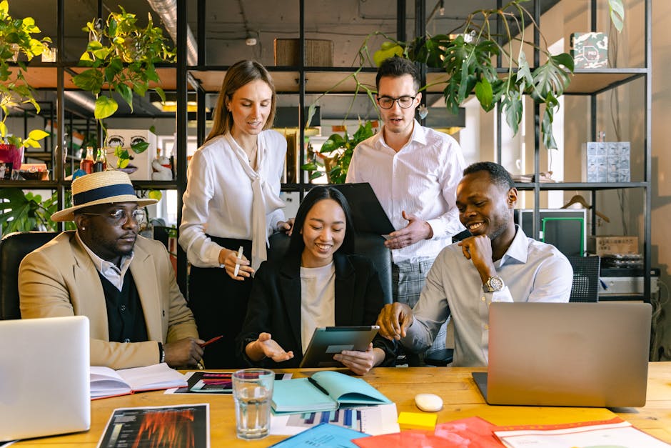 A group of diverse professionals working collaboratively in a modern office setting