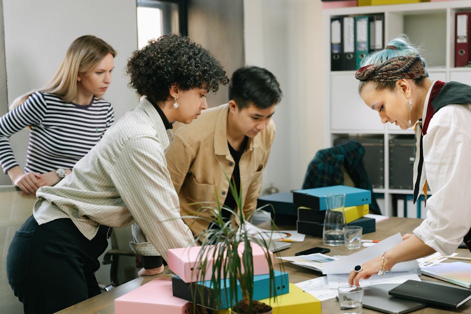 A diverse team of colleagues collaborating on a business project in a modern office setting