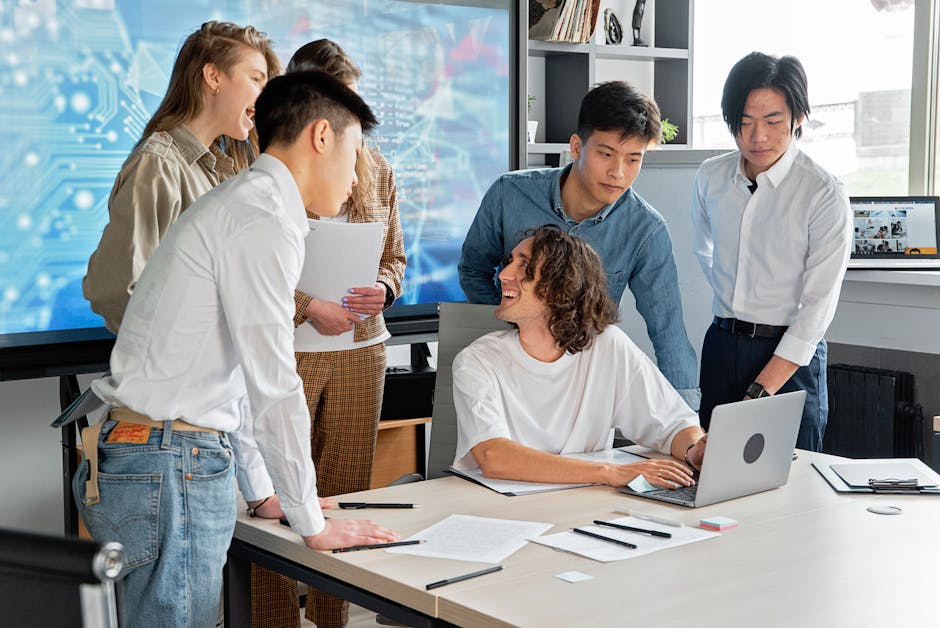 A diverse team of professionals engaged in a collaborative meeting in a modern conference room